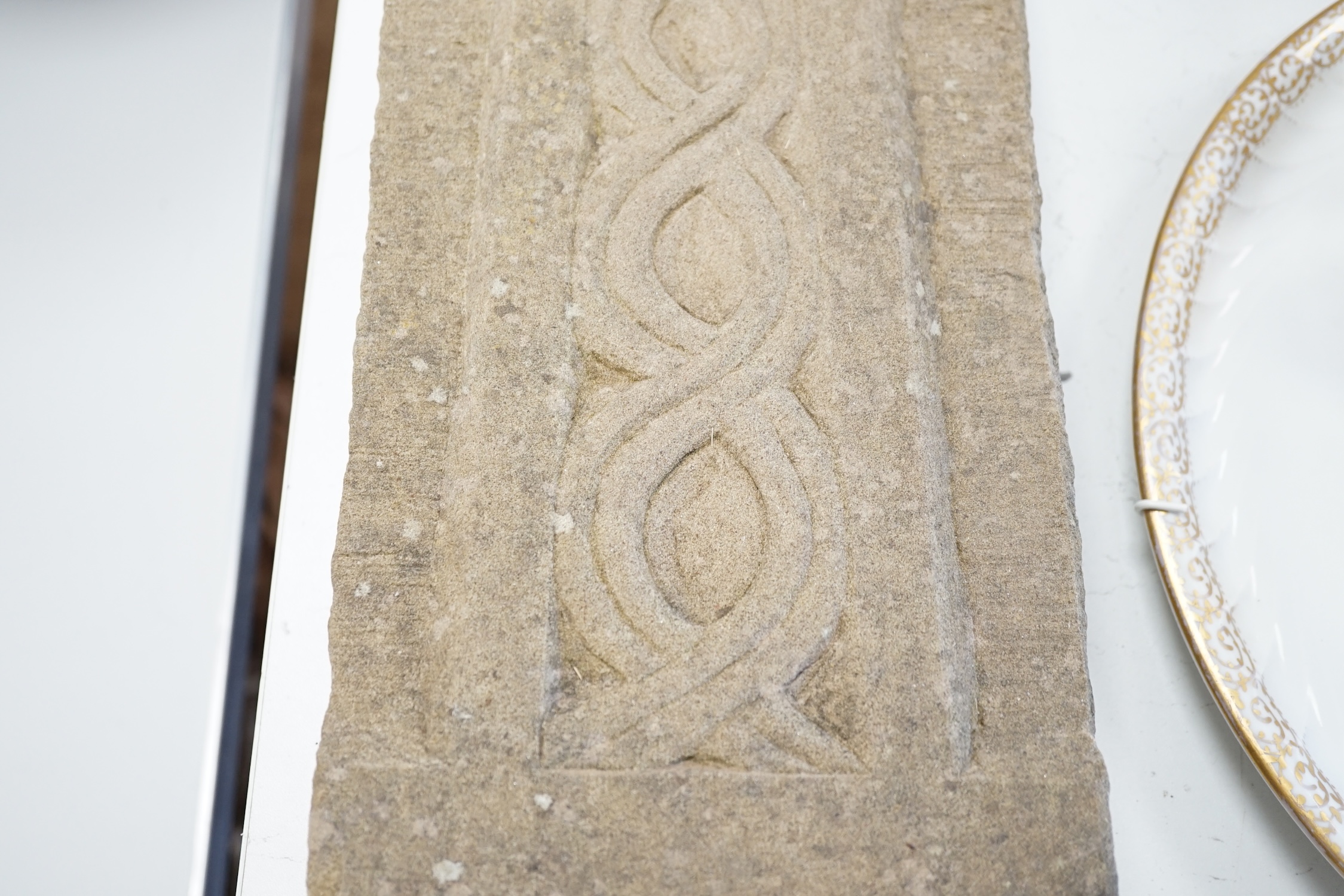 A carved stone Celtic cross, 56 x 18cm. Condition - good